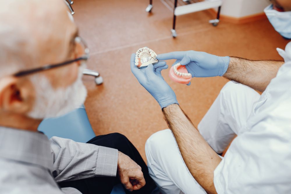 a man is getting dental bridges